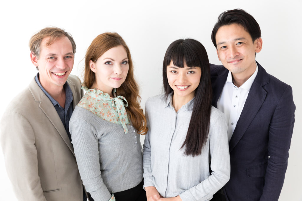 portrait of young business group on white background